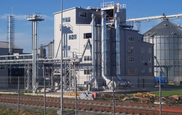 istock Granary, elevator - an industrial complex for storage, sorting and shipment of grain by rail. Agro-processing and manufacturing plant. Agricultural complex. 1271765130
