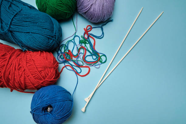 istock Group of various yarn balls and knitting needles closeup 1271765188