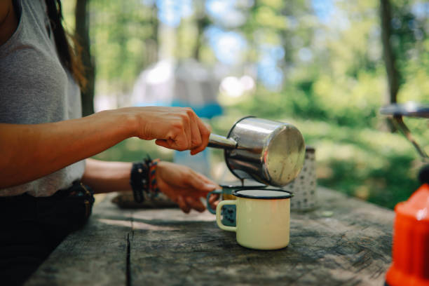 istock Woman is making morning coffee while camping 1271766492