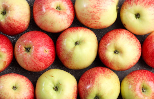 istock Ripe red green apples background 1271767049