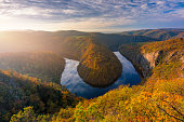 Beautiful Vyhlidka Maj, Lookout Maj, near Teletin, Czech Republic. Meander of the river Vltava surrounded by colorful autumn forest viewed from above. Tourist attraction in Czech landscape. Czechia.