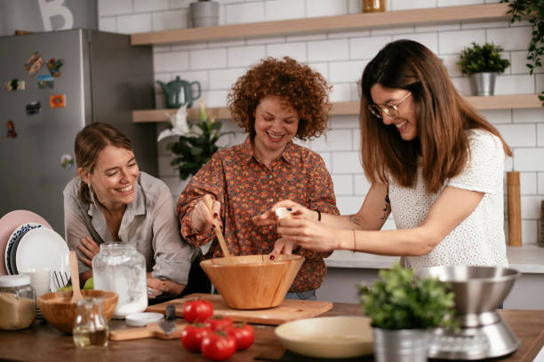 istock Sisters preparing delicious food at home 1271769426