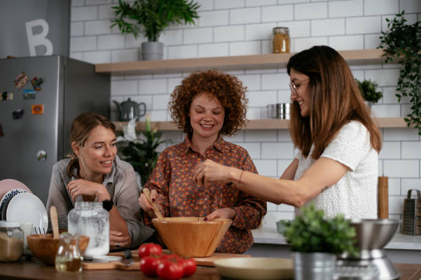 istock Sisters preparing delicious food at home 1271769430