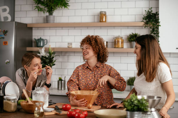 istock Sisters preparing delicious food at home 1271769757