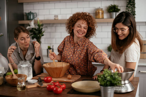 istock Sisters preparing delicious food at home 1271769905