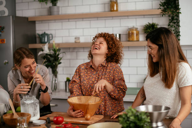 istock Sisters preparing delicious food at home 1271769982
