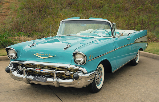Westlake, United States - October 21, 2017: Front side view of an aqua color 1957 Chevrolet Bel Air convertible classic car.