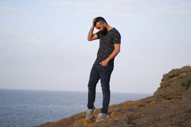 man is standing up on the mountain