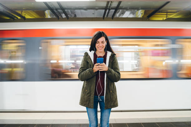 istock Checking social media on phone at subway station 1271777962