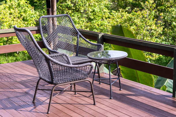 istock Two chairs and table on the backyard in tropical garden with beautiful view 1271779881