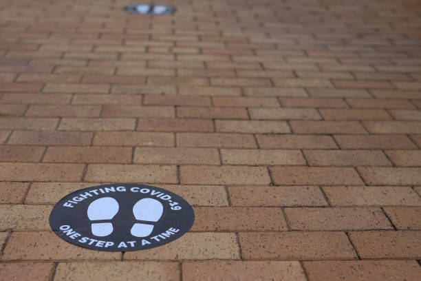 istock A Covid 19 sign at a shopping mall asking people to keep a safe distance from each other 1271784119