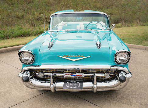 Westlake, United States - October 21, 2017: Front view of an aqua color 1957 Chevrolet Bel Air convertible classic car.