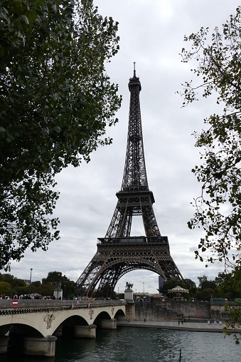 View of the Eiffel Tower in Paris in early autumn as well as the Pont d'Iena and the Seine