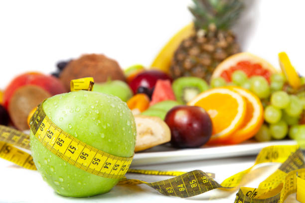 istock A measuring tape around a Granny Smith Apple isolated 1271787855