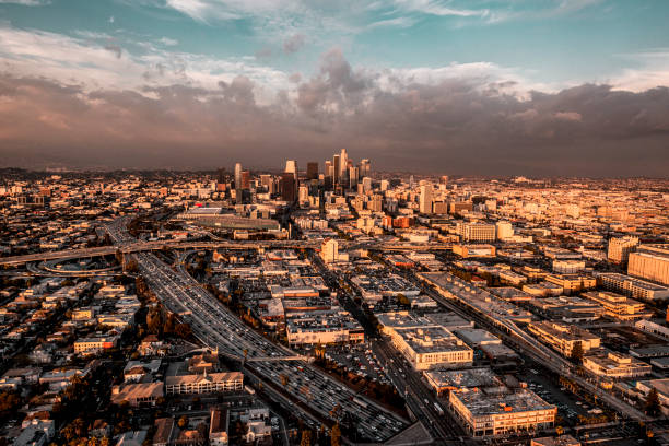 istock Cloudy sky and sunset over highway of Los Angeles 1271787976