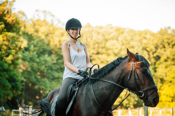 istock Woman sitting on horse 1271789158