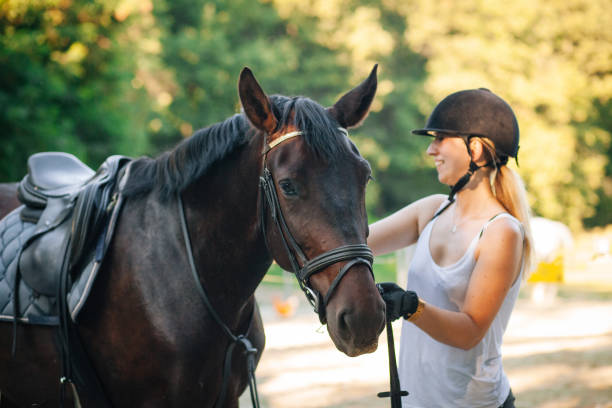 istock Happy woman hugging her horse 1271789159