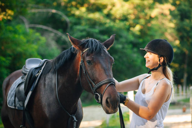 istock Happy woman hugging her horse 1271789214