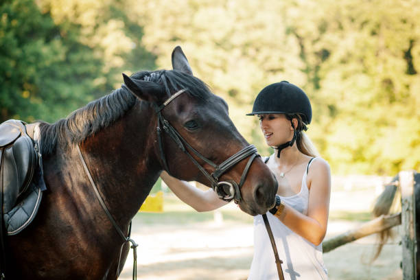 istock Happy woman hugging her horse 1271789254