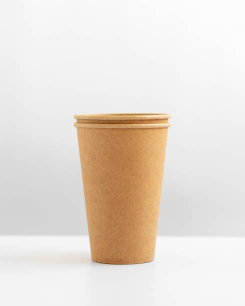istock Paper cups on gray and white background. 1271790210