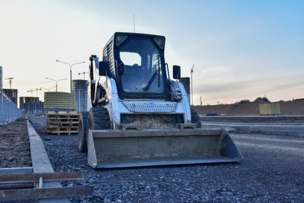 istock Bobcat skid-steer loader for loading and unloading works on city streets. ompact construction equipment for work in limited conditions. Road repair at construction site 1271792798