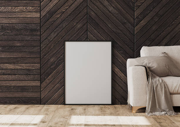 istock Empty frame mockup on the floor near sofa and dark wood wall, 3d rendering 1271794938