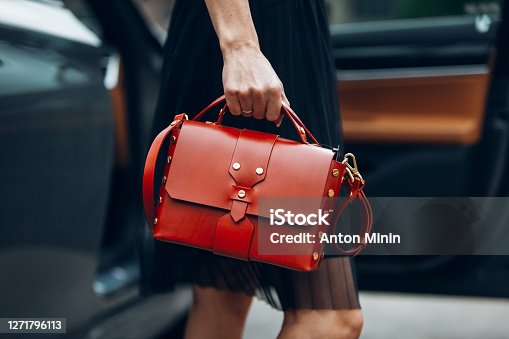 https://media.istockphoto.com/id/1271796113/photo/women-is-holding-handbag-near-luxury-car.jpg?s=170667a&w=is&k=20&c=K6hdLxGf-5XD0lVvoleI1ILMlJBXEEXGdsfGbQI4Tt4=
