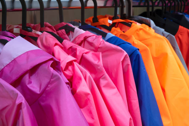 istock Colorful t-jacket on hangers, close up view 1271797263