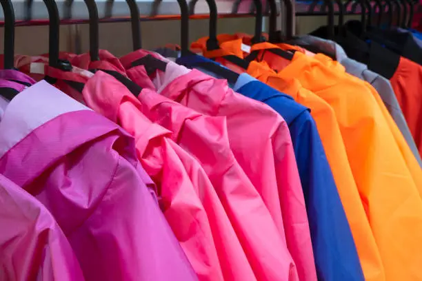 Colorful t-jacket on hangers, close up view