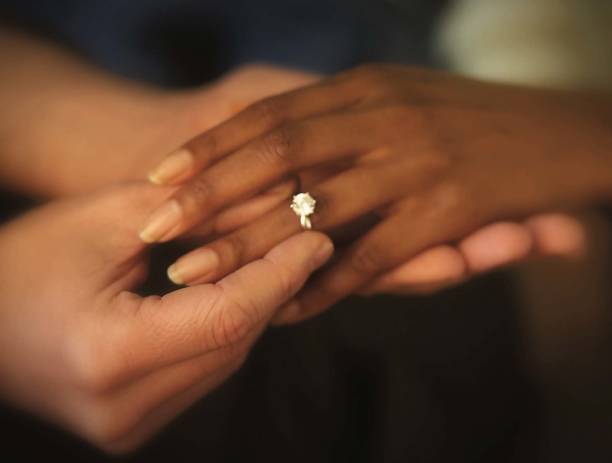 Kalmte Verwoesten telefoon Interracial Hands Putting On Engagement Ring Stock Photo - Download Image  Now - Wedding, Engagement Ring, Engagement - iStock