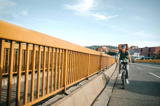 istock Delivering food on bicycle in city 1271799839