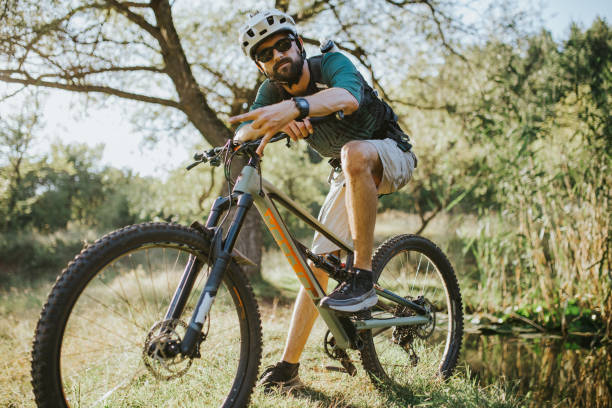 istock Portrait of a bearded man siting on a bicycle. 1271800917