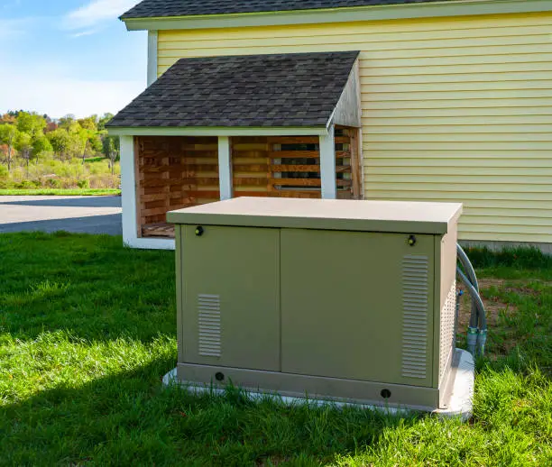 Residential standby generator on a concrete pad