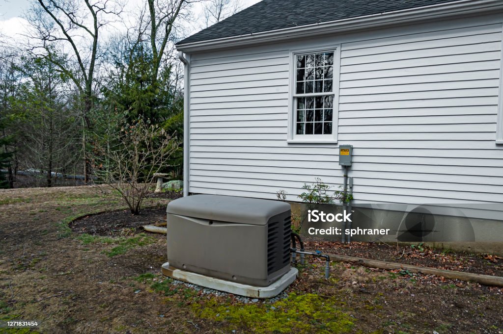 Residential generator Residential standby generator on a concrete pad Generator Stock Photo