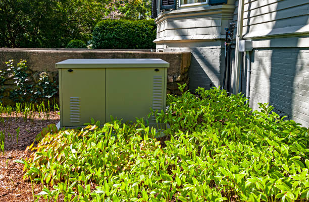 Residential generator Residential standby generator installed on a concrete pad generator photos stock pictures, royalty-free photos & images