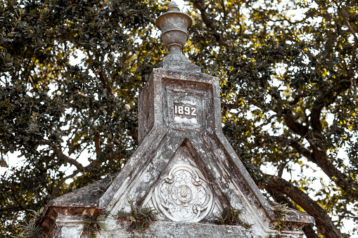 Cross on the top of a tomb in Lafayette cemetery in New Orleans.