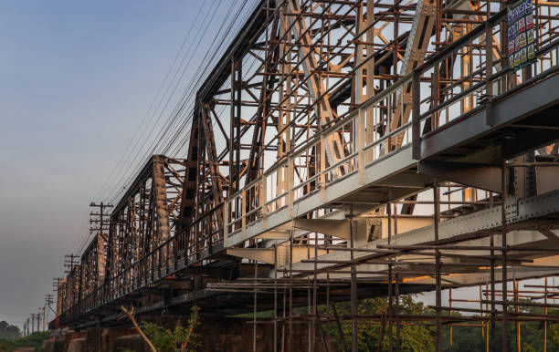 istock Old railroad tracks on Black Bridge or Lampang Railway Bridge. 1271844950