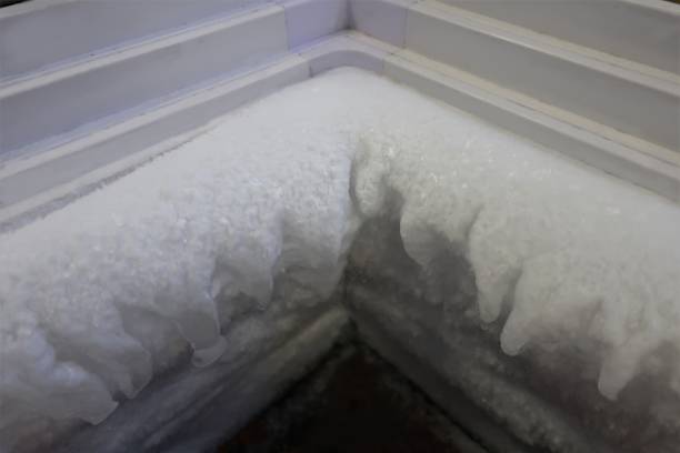 istock Ice formed on the walls of a refrigerator. 1271849542