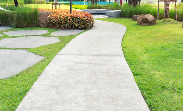 Walkway and bush in garden. Walkway and bush in garden. Also called concrete pavement, floor, passage, path, footpath, pathway or passageway. Include natural plant, lawn and grass. For walking along and decorative park, garden. pedestrian walkway stock pictures, royalty-free photos & images