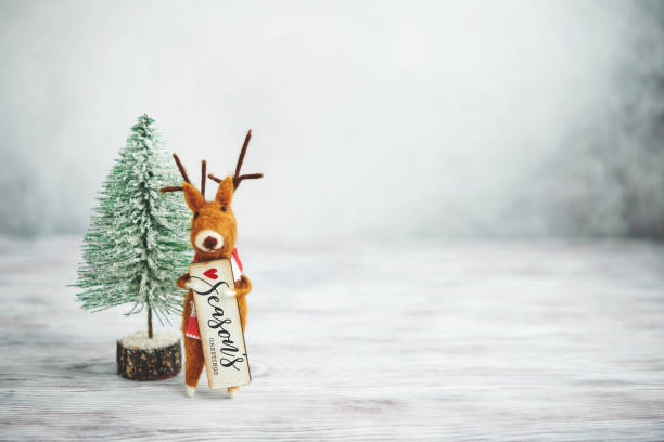 istock Bright Christmas Background with Tree and Cute Felt Reindeer 1271851464