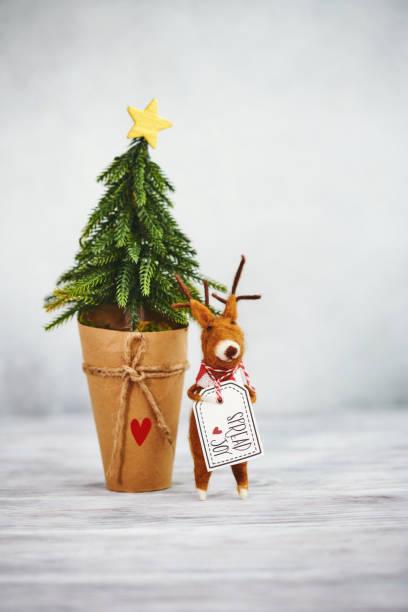 istock Bright Christmas Background with Tree and Cute Felt Reindeer 1271851472