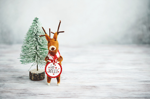 Bright Christmas Background with Tree and Cute Felt Reindeer