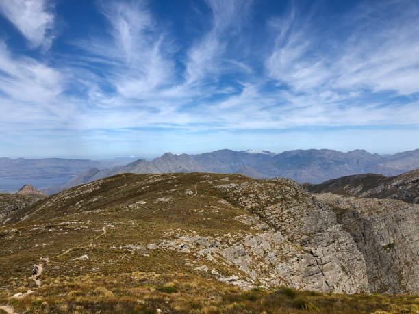 istock Fit female running down a mountain trail 1271865008