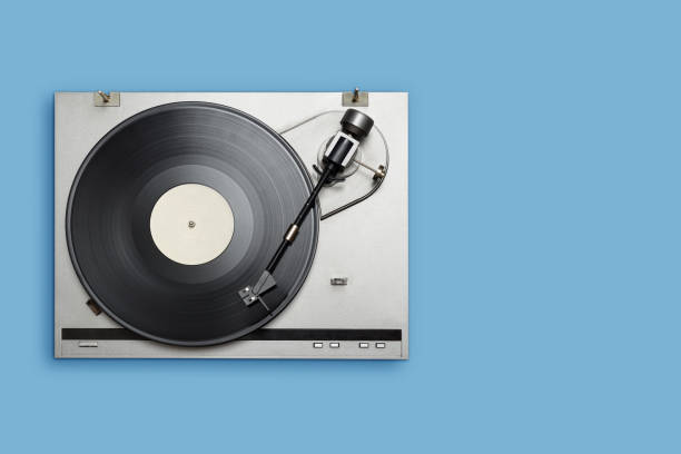 istock Vinyl player with long play or LP record on blue background. 1271865050