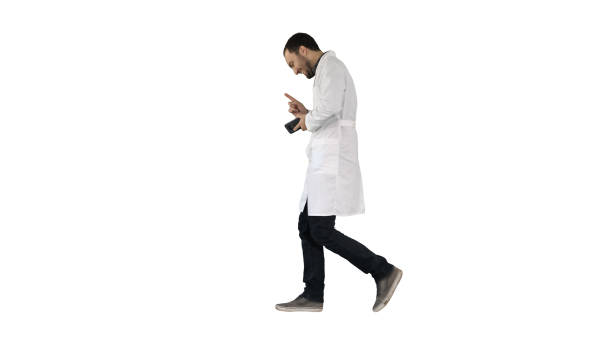 istock Walking attractive laughing doctor on white background 1271865737