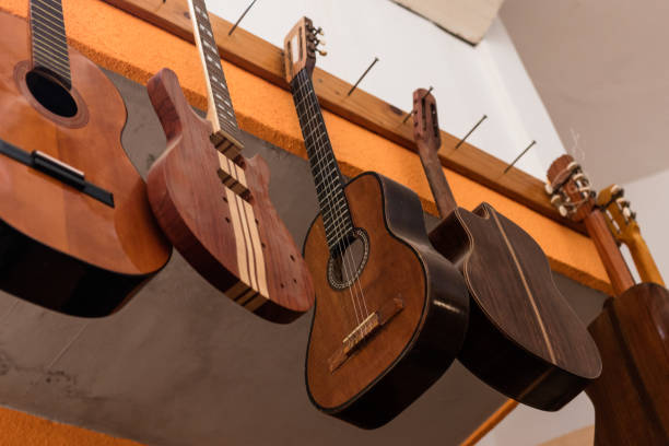 istock Acoustic guitars hanging on the wall of studio 1271870547