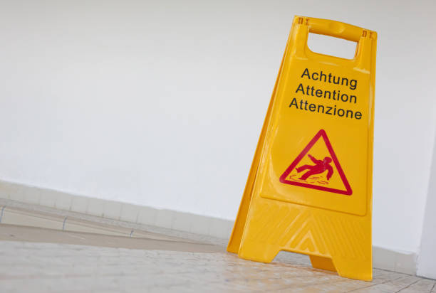 istock Wet floor sign by indoor swimming pool, selective focus 1271871132