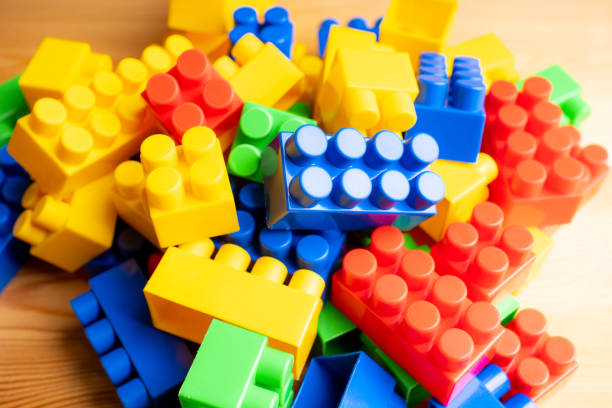 istock Plastic toy blocks different colours on the wooden table 1271872382
