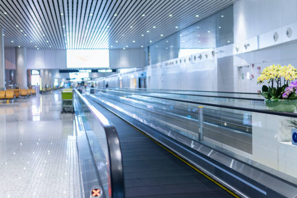istock Motion of airport moving walkway 1271873956
