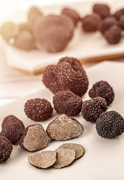 istock Whole and sliced black truffle 1271874705